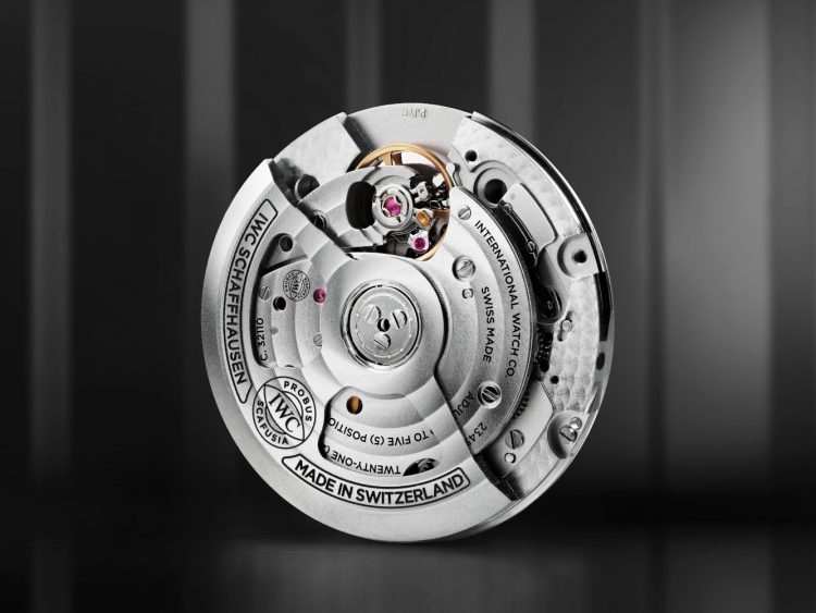The IWC-manufactured 32100 calibre displaying the IWC logo with "Made in Switzerland" as well as other information engraved into the surface