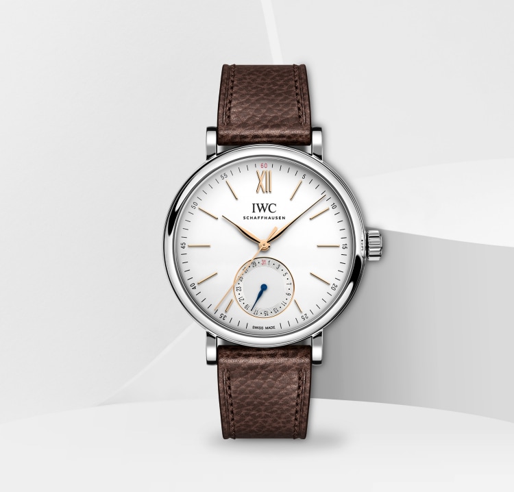 Image of IWC Portofino Automatic Pointer Date IW359201 with white dial, silver case and brown calfskin strap placed on white surface in white background.