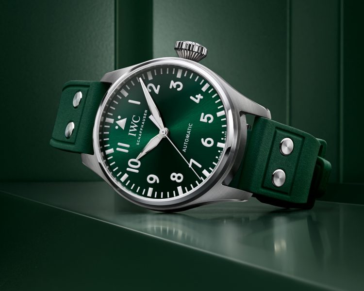 Front image of a green dial watch with a green rubber strap